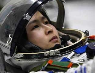 China sends first woman into space