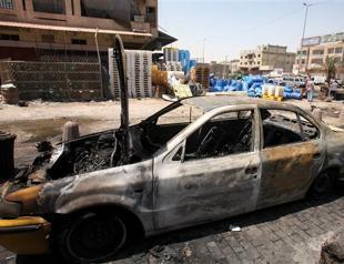 Officials: 14 killed in twin Iraq car bombs