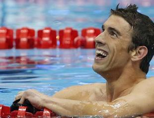 Phelps swims into history with 19th Olympic medal