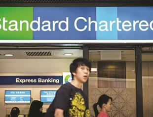 Standard Chartered posts record high 1st half profit