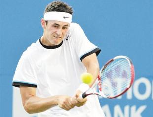 Tomic beats home favorite Harrison
