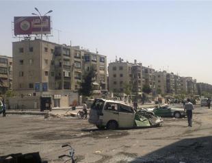 In Syria, mortars kill 21 in Damascus refugee camp