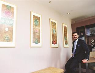 Businessman eyes supports art via his hotel and holding