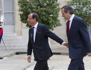 Greek PM gets support but no concessions from Paris, Berlin