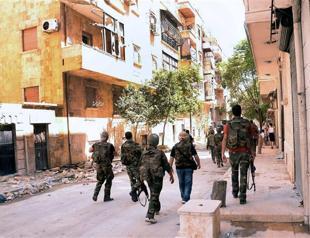 Syria accused of massacre as hundreds of bodies found