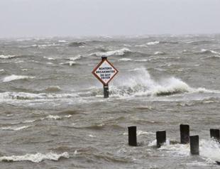 Isaac waters top Louisiana levee, homes flooded