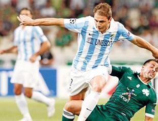Malaga advances to CL groups