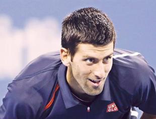 Djokovic, Serena ease to next round