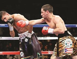 Danny Garcia shocks Khan to unify WBA and WBC titles