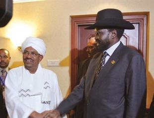 Sudan and South Sudan leaders hold peace talks, shake hands