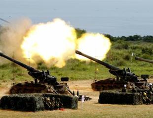 Taiwan tests new weapons in China war simulation