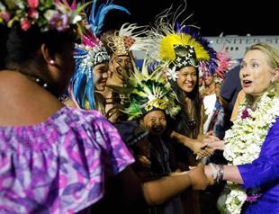 China warns against intervention as Clinton visits Asia