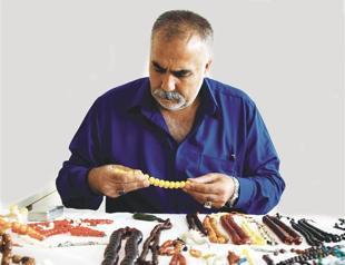 Collector promoting art of prayer beads