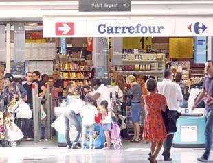 French retailer Carrefour to reduce staff and wages