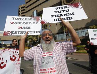 Blair, Bush should face trial over Iraq war: Tutu