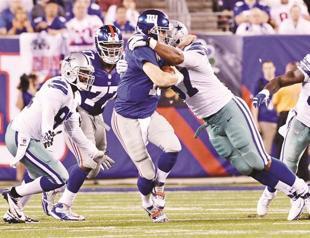 Cowboys cut down Giants in opener
