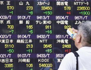 Japan holds steady on rates, policy