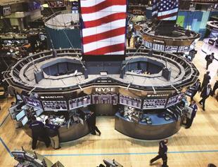 Signals of stimulus from Federal Reserves pushes stocks, oil up