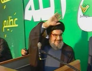 Hezbollah chief makes rare public show at Beirut rally