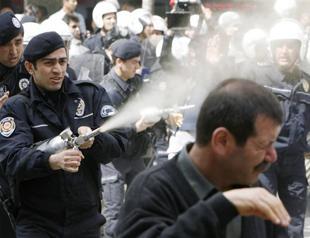 Police use pepper spray on anti-war protesters outside Parliament