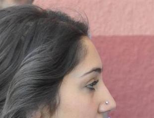 Woman forced to remove piercing before sitting exam