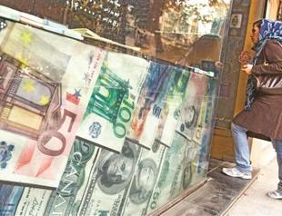 Iran sells subsidized dollars to defend rial