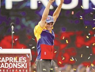 Chavez rival Capriles holds big rally as election looms