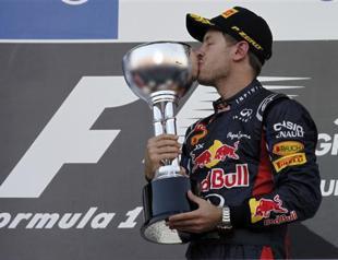 Vettel win puts title on knife-edge