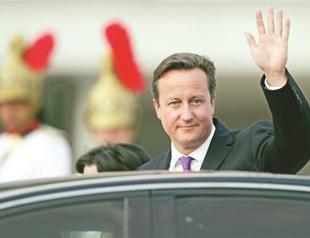 Britain plays hardball on EU budget, threatens veto