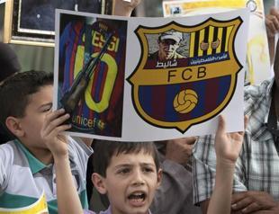 Gaza fans defiantly cheer on Barcelona FC