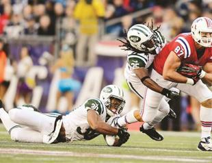 Patriots edge NY Jets in overtime to lead division