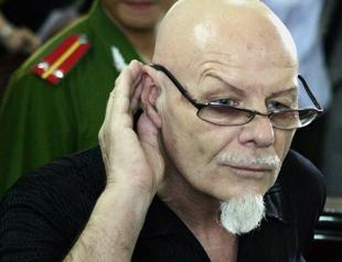 Pop star Glitter arrested in British sex abuse probe