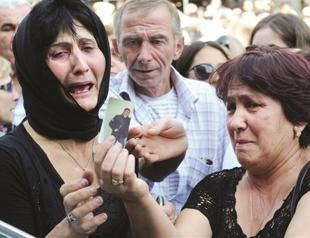 Minister quits in Georgia over prison scandal