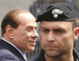 Berlusconis sentence cut to one year