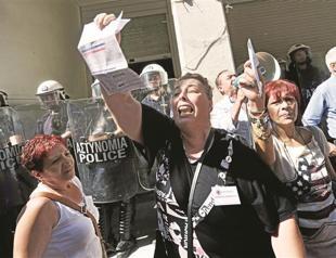 Euro loses over Greek woes as austerity move hits block