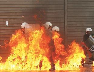 Greek coalition passes key budget cuts despite anger