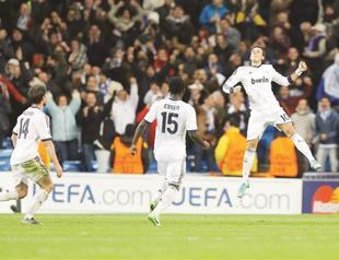 Özil goal rescues draw for Madrid against Dortmund