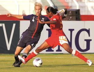 Japan defeats Oman to close in on World Cup