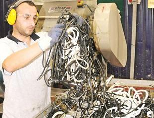 Tons of e-waste waiting for new recycling plants
