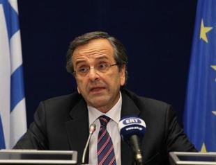Greek PM hails EU-IMF deal to ease debt