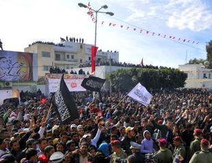 Rocks, insults on Tunisian uprising anniversary