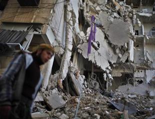 Syria troops press Homs offensive, 23 children die