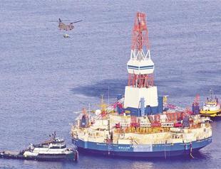 Drilling barge pulled from rocks off Alaska Island