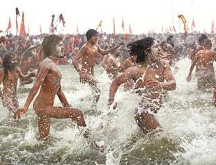 Hindus run in Ganges River to cleanse sins