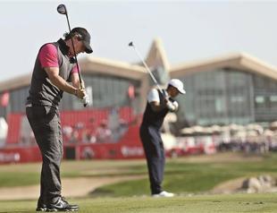 McIlroy, Woods make slow starts to Abu Dhabi event