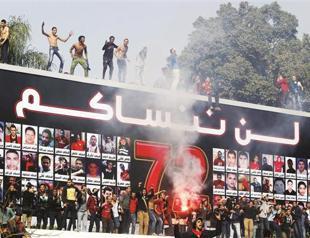 Morsi under pressure as football brawls rock Egypt