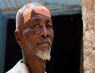 Malian soldier beats man for having a beard