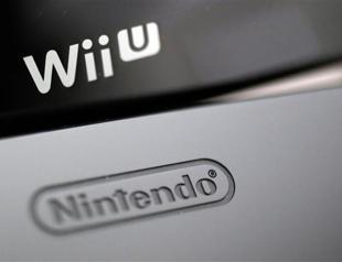 Nintendo boosts earnings forecast, cuts Wii U sales target