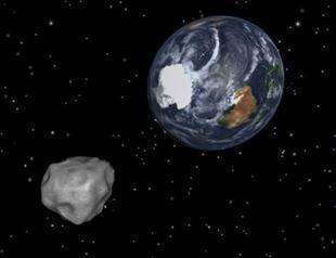 Asteroid whizzes past Earth