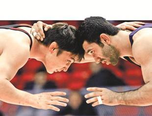 Political foes join forces together to keep wrestling in Olympic Games